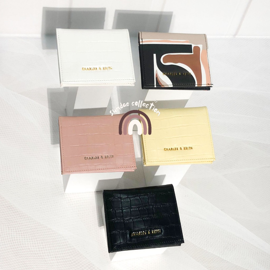 CK PRINTED MINI FOLDING WALLET - EMBOSSED CK008