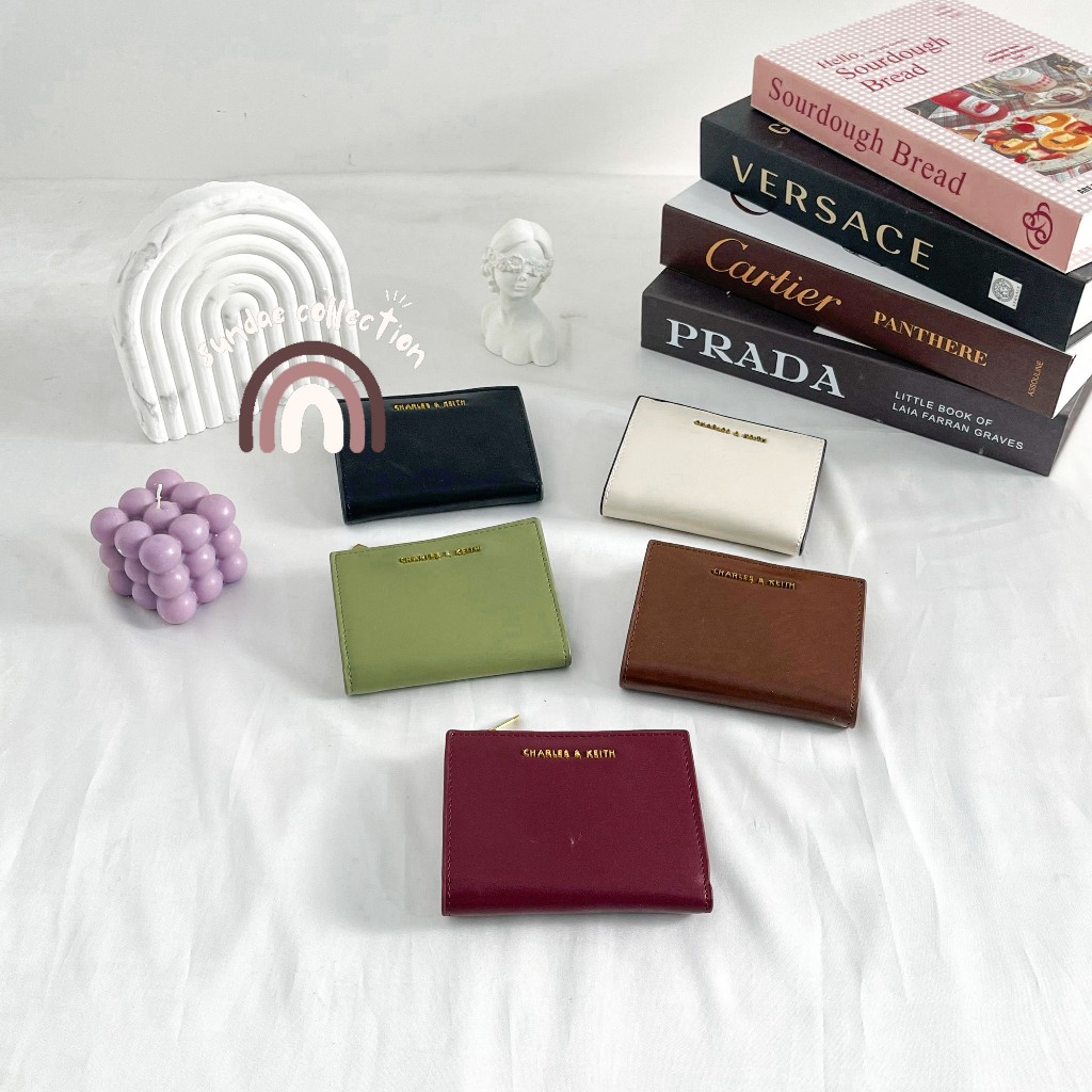 กระเป๋าสตางค์ผู้หญิง FOLDING CK MINI TOP ZIP LEATHER WALLET - EMBOSSED EMBOSSED CK907