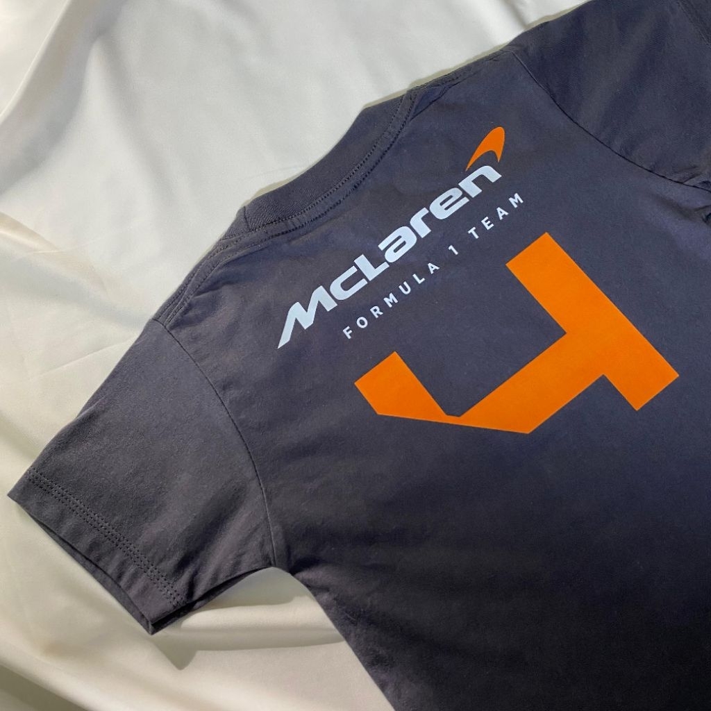 เสื้อยืดทีม McLaren Norris/Piastri Formula 1 สําหรับ (เด็กและผู้ใหญ่)