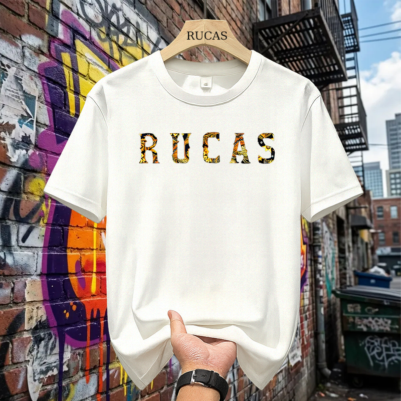 เสื้อยืด RUCAS ดั้งเดิมสําหรับผู้ชายและผู้หญิง - เสื้อยืดสีดํามีโลโก้ RUCAS ลายทอง สตรีทแวร์ Unisex
