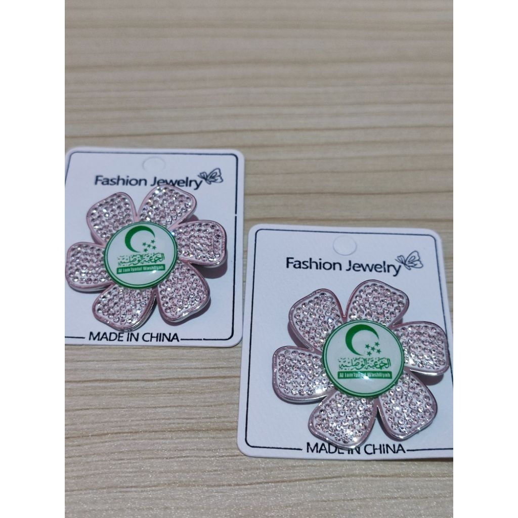 DIAMOND TITANIUM BROOCH AL JAMAN WASHLIAH โลโก้