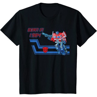 Transformers Optimus Prime G1 Box Art Born In 1984 เสื้อยืดสีขาว ผ้าฝ้ายคุณภาพสูงแขนสั้นเทรนด์แฟชั่น