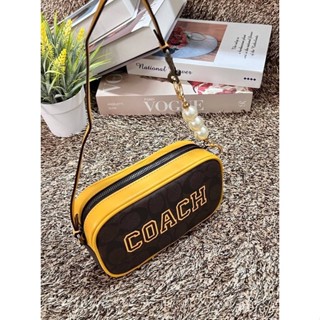 COACH JAMIE WRISTLET IN SIGNATURE CANVAS WITH VARSITY MOTIF