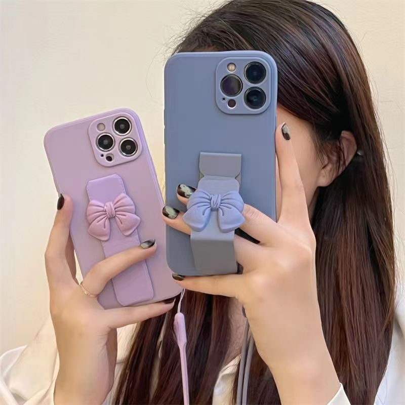 เคสโทรศัพท์มือถือ ซิลิโคน พร้อมสายคล้อง ประดับโบว์แม่เหล็ก สําหรับ 6 7 8 SE 2020 6P 7P 8P X XS XR XsMax 11 12 13 Pro 11 12 13 Pro Max
