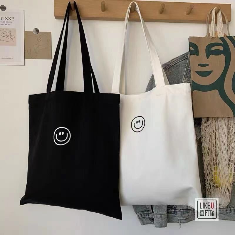 มีส่งด่วน Bewtyshop กระเป๋าผ้าแคนวาส รุ่นลายยิ้ม แบบเกาหลีเกาใจ มี 2 สี (ดำ ขาว) – โปรปัง