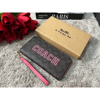 COACH CB865 LONG ZIP AROUND WALLET IN SIGNATURE CANVAS WITH VARSITY MOTIF