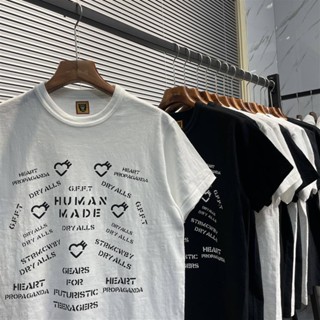 เสื้อยืดแขนสั้น ผ้าฝ้ายแท้ ทรงหลวม พิมพ์ลายตัวอักษร Human Made สไตล์ญี่ปุ่น สําหรับผู้ชาย และผู้หญิง