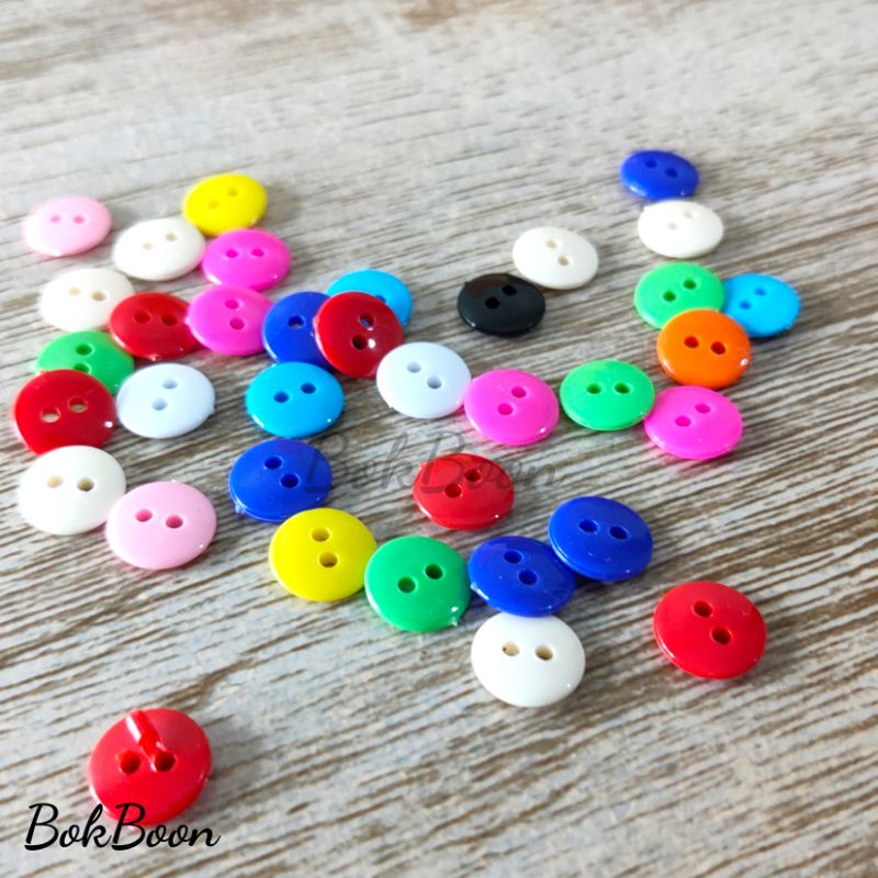 กระดุมคละสีขนาด11mm. 100ชิ้น