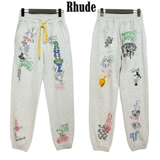 Rhude ของแท้ 100% กางเกงวอร์ม ผ้าฝ้าย ทรงหลวม ลายการ์ตูนกราฟฟิติ แนวสตรีท สไตล์อเมริกัน แฟชั่นสําหรับผู้ชาย และผู้หญิง