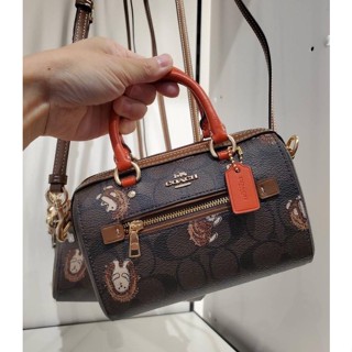 (ผ่อน0%) กระเป๋าสะพายข้าง COACH MINI ROWAN CROSSBODY IN SIGNATURE CANVAS WITH HEDGEHOG PRINT CC430 หมอน 6 นิ้ว สีน้ำตาล