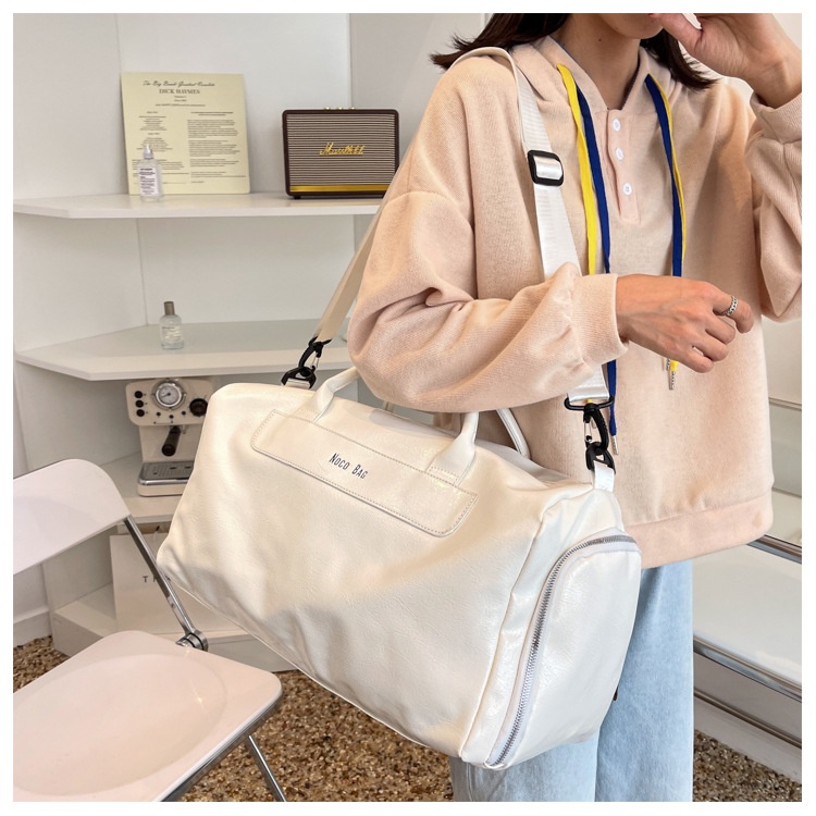 🔥ส่งเร็ว กระเป๋าหนังpuกันน้ำสวยมาก สำหรับเดินทางขนาดใหญ่ มีช่องใส่รองเท้าโดยเฉพาะ สะพายเข้ายิมเท่ๆ - รูปที่ 4