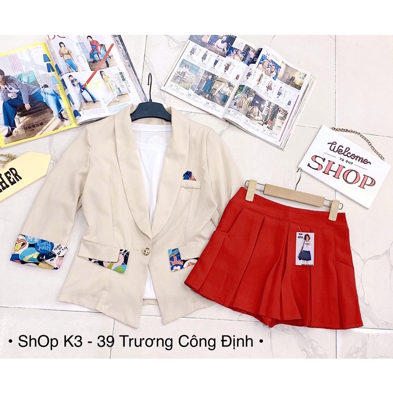 Sleeve Vest Set ผสมผสานกับกระโปรงและกางเกงสีแดง