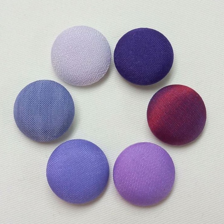 กระดุมปั๊ม ผ้าสีม่วง แพ็คละ 12 เม็ด