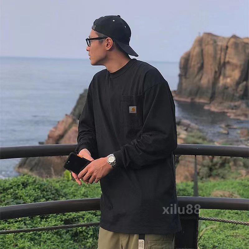 CARHARTT เสื้อยืดแขนยาว คอกลม ผ้าฝ้าย แต่งกระเป๋า สไตล์คลาสสิก สําหรับผู้ชาย และผู้หญิง
