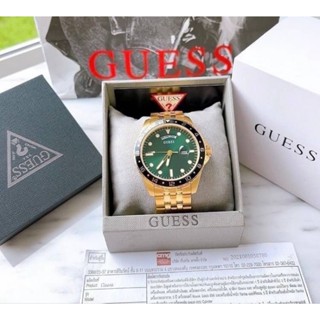 Guess ผช.ตัวเรือนและสายสเตนเลสสีทอง หน้าปัดสีเขียว ขอบหน้าปัดสีดำ