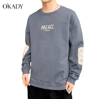 OKADY เสื้อสเวตเตอร์แฟชั่นชายคอกลมสไตล์เกาหลีเสื้อแจ็คเก็ตพิมพ์ลายหลวมสวมคู่ลำลองผ้าฝ้ายด้านบน