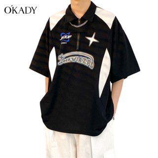 OKADY เสื้อยืดผู้ชายแฟชั่นคู่รักสไตล์วิทยาลัย ins แขนสั้นหลวมสบาย ๆ เสื้อโปโลปกพิมพ์เสื้อเชิ้ต