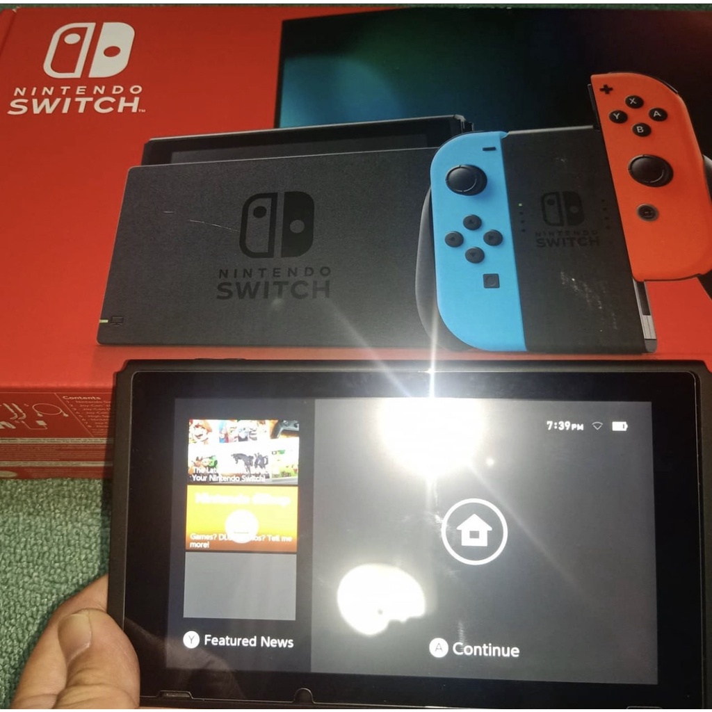 Nintendo Switch เวอร์ชัน 2 32GB คอนโซลสีเทาพร้อม Joy-Con สีแดงนีออนและสีน้ำเงินนีออน