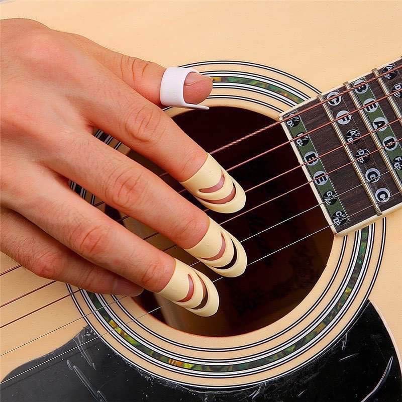 Mugen Finger Pick (1ชุดมี 4 ชิ้นตามรูปจ้า)เหมาะสำหรับคนที่ไม่ต้องการไว้เล็บยาว ให้เสียงกังวาล คมชัด เหมือนเล็บจริงๆค่ะ