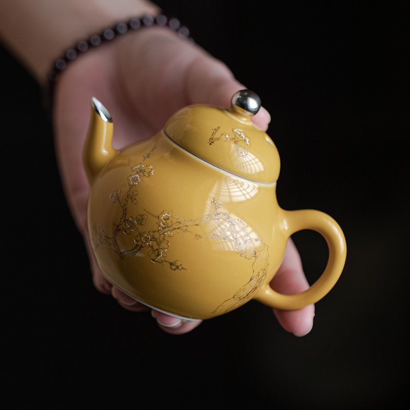 Handpainted glazed pearshaped teapot handheld pot with ball hole