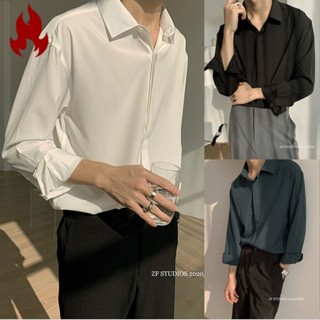 HOTMAN เสื้อเชิ้ตผู้ชาย แขนยาว เดรปไร้เหล็ก เกาหลี ลำลอง หลวม เสื้อเชิ้ต เสื้อเชิ้ตสีขาวดำ อินเทรนด์ ฤดูใบไม้ผลิและฤดูใบไม้ร่วง