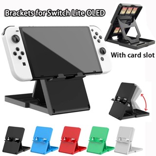 แท่นวาง/ขาตั้ง พกพา Nintendo Switch Lite Oled เก็บตลับเกมด้านหลังได้ เว้นร่องเสียบสายชาร์ตได้ แข็งแรง ไม่ก๊อกแก๊ก