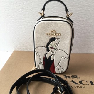 Coach CC328 Disney X Coach Eva Phone Leather Crossbody With Cruella Motif