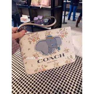 กระเป๋าคล้องมือ Coach ดัมโบ้และผองเพื่อน