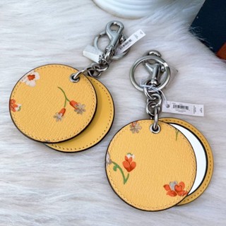 พวงกุญแจ กระจก ทรงกลม ‼️ Mirror Bag Charm With Mystical Floral Print (COACH C8233) สีเหลือง