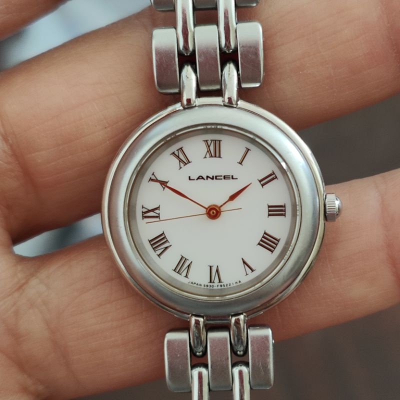 นาฬิกาญี่ปุ่นมือสอง Lancel เรียบหรู สภาพสวย หน้าขาว หลักโรมัน สายยาว 15.5 cm. ระบบ quartz