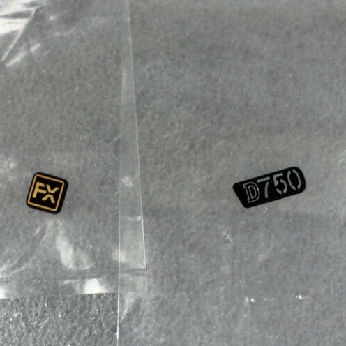 1PCS ใหม่สําหรับ Nikon D750 ด้านหน้า FX โลโก้ชื่อแผ่นฐานแผ่นป้ายกล้องอะไหล่หน่วย