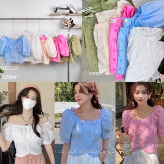 Hello Shop : เสื้อคอปาดแขนตุ๊กตา รูดใต้อกแต่งกระดุมมุกรูปหัวใจ