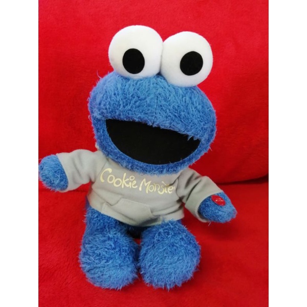 ตุ๊กตา​ คุกกี้​มอนส​เตอร์​ Cookie monster นั่งตีขา​ ตุ๊กตา​ตัว​สูงประมาณ​ 22 ซม.