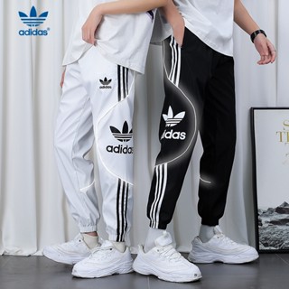 Adidas ของแท้ 100% กางเกงวอร์ม ทรงหลวม ปักลายโลโก้ ขนาดเล็ก แถบสะท้อนแสง แฟชั่น สําหรับผู้ชาย ผู้หญิง