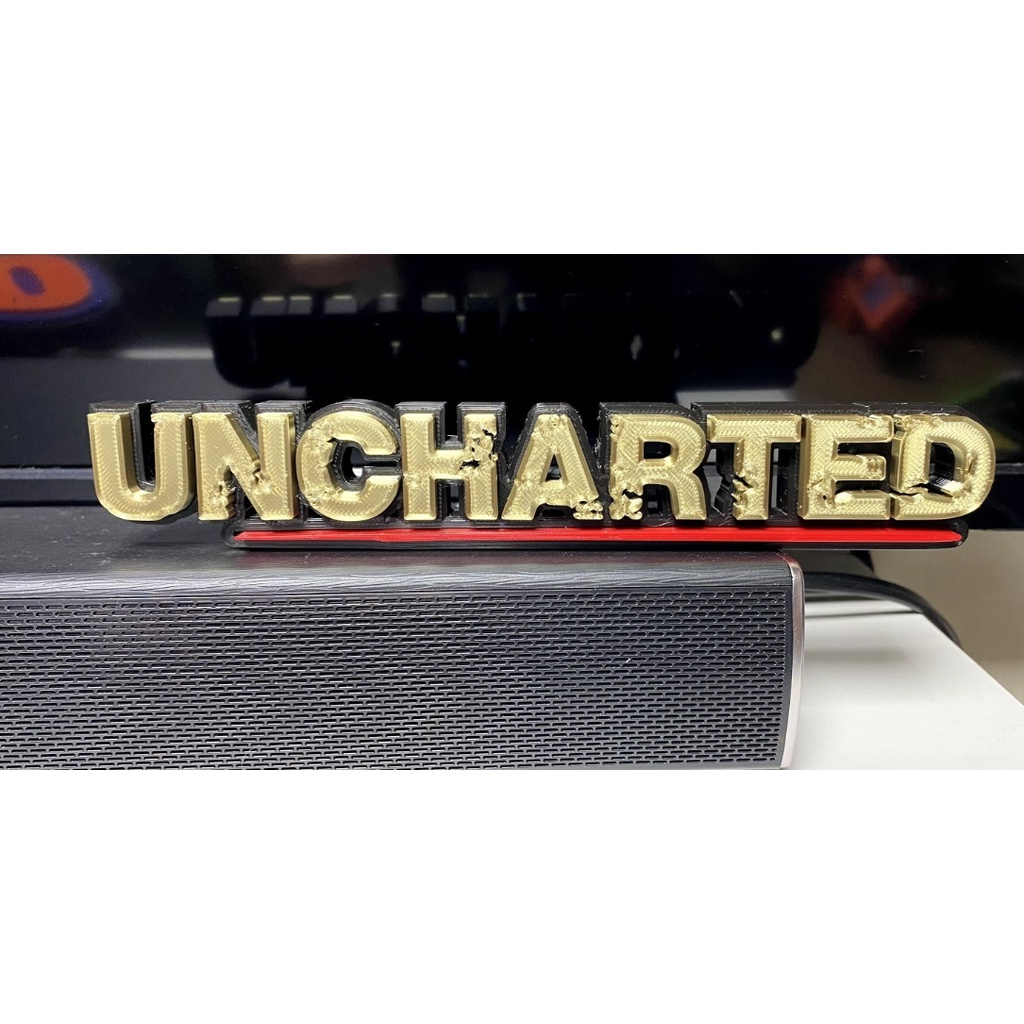 โลโก้ UNCHARTED (ของตกแต่ง 3 มิติ)