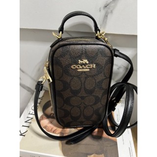 (ผ่อน0%) กระเป๋าใส่โทรศัพท์สะพายข้าง Coach Eva Phone Crossbody In Signature Canvas CC872 ลายซี สีน้ำตาลเข้ม