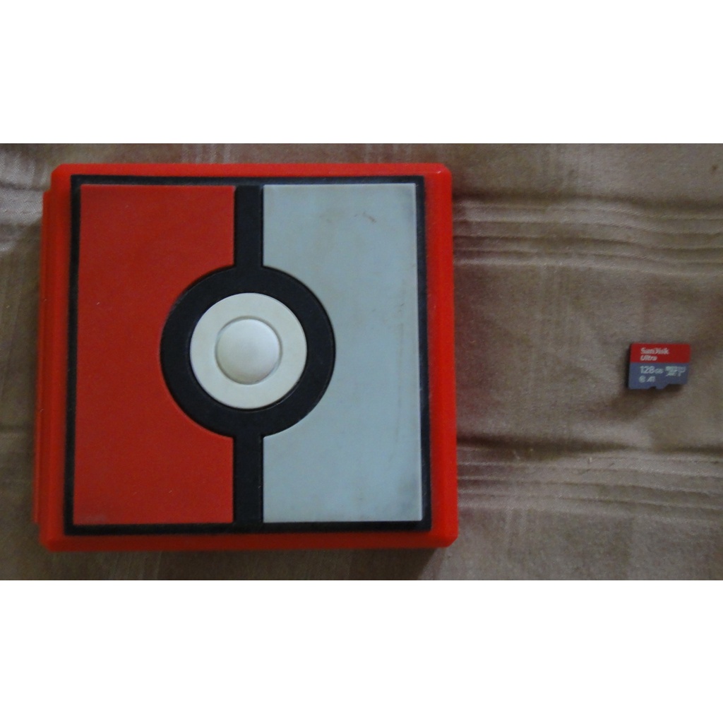 ขาย กล่องใส่ตลับเกมส์ Nintendo Switch ลาย Pokeball ใส่ได้ 12 ตลับ + Micro SD Card Sandisk Ultra 128GB (มือสอง)