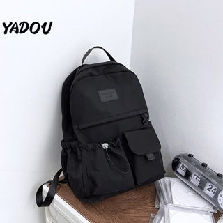 YADOU กระเป๋าเป้ เทรนด์แฟชั่นใหม่ กระเป๋าเป้สีทึบ วัสดุไนลอน กระเป๋าเป้ลำลอง นักเรียน พร็อพ กระเป๋านักเรียนความจุขนาดใหญ่