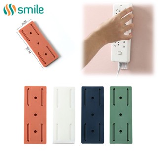 ღ 1Pc Wall-Mounted Punch-Free Plug Holder Self-Adhesive Plug Socket Fixer Seamless Power Strip Holders Home Cable Wire Organizer Racks Household Accessories