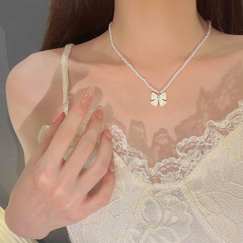 Roselife เกาหลี น่ารัก สีขาว โบว์ มุก ลูกปัด โชคเกอร์ สร้อยคอ สําหรับผู้หญิง เด็กผู้หญิง หรูหรา โบ เสน่ห์ สร้อยคอโซ่สั้น เครื่องประดับ ของขวัญ