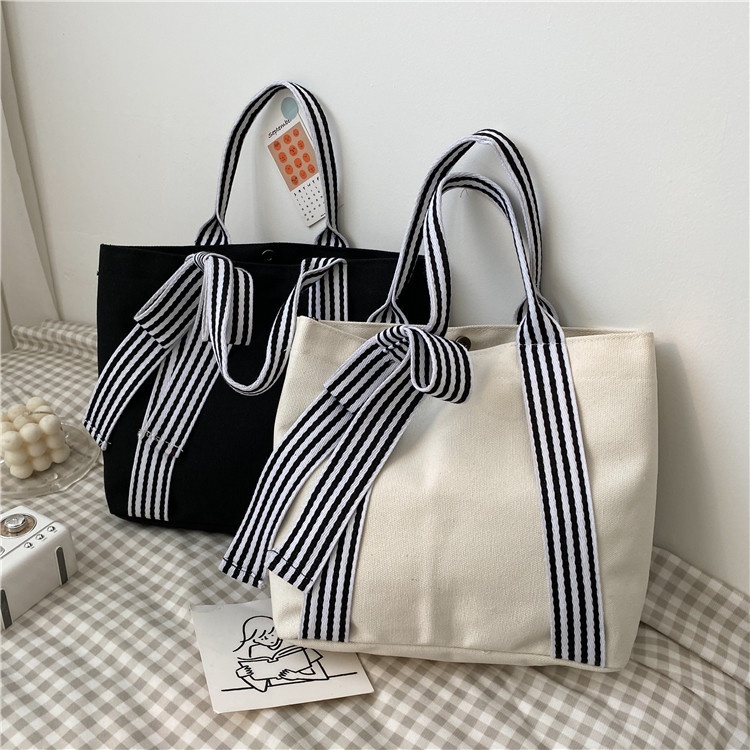 (w243)กระเป๋าผ้าถือช้อปปิ้ง แต่งเชือกหูหิ้วทรงโบว์ ดูน่ารักคิ้วๆ vgetbag