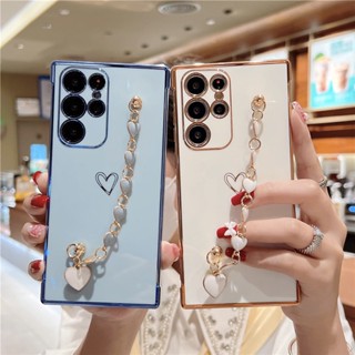 เคสโทรศัพท์มือถือแบบนิ่ม TPU กันกระแทก ลายหัวใจ พร้อมสายคล้องข้อมือ หรูหรา สําหรับ Samsung Galaxy S23 UItra S22 S21 Plus S21 FE