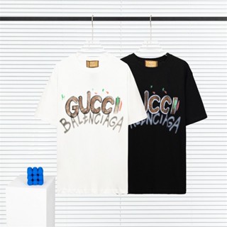 เสื้อยืดคอกลม แขนสั้น พิมพ์ลายโลโก้ตัวอักษร GUC ผ้าฝ้ายแท้ ทรงหลวม คุณภาพสูง แฟชั่นสําหรับวัยรุ่น และผู้ชาย และผู้หญิง