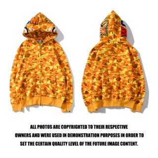 2023 Bape × MCM เสื้อแจ็กเก็ต ลายพราง ปักโลโก้ด้านข้าง Bape เสื้อกันหนาวมีฮู้ด ผ้าฝ้าย พิมพ์ลาย มีซิป แฟชั่น สําหรับผู้ชายและผู้หญิง Fashoin เสื้อแจ็กเก็ตเบสบอล แขนยาว ลายพราง มีซิป สไตล์คลาสสิก สําหรับผู้ชาย และผู้หญิง