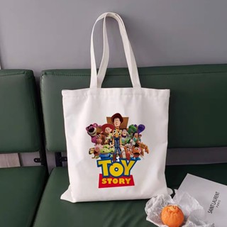 กระเป๋าช้อปปิ้ง ทรงโท้ท ขนาดใหญ่ จุของได้เยอะ พิมพ์ลายการ์ตูนอนิเมะ Toy Story แฟชั่นสําหรับนักเรียนหญิง