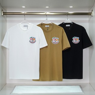 Mc- เสื้อยืดแขนสั้นลําลอง ทรงหลวม แฟชั่นสําหรับผู้ชาย และผู้หญิง