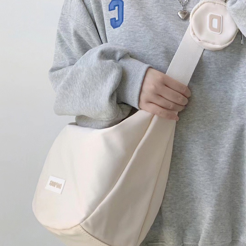 IELGY dumpling bag ญี่ปุ่นไนลอน messenger casual ความจุขนาดใหญ่กระเป๋าเกี๊ยวผ้าใบสําหรับผู้หญิง