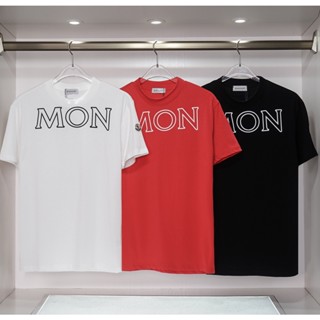Mc- เสื้อยืดแขนสั้นลําลอง ทรงหลวม แฟชั่นสําหรับผู้ชาย และผู้หญิง