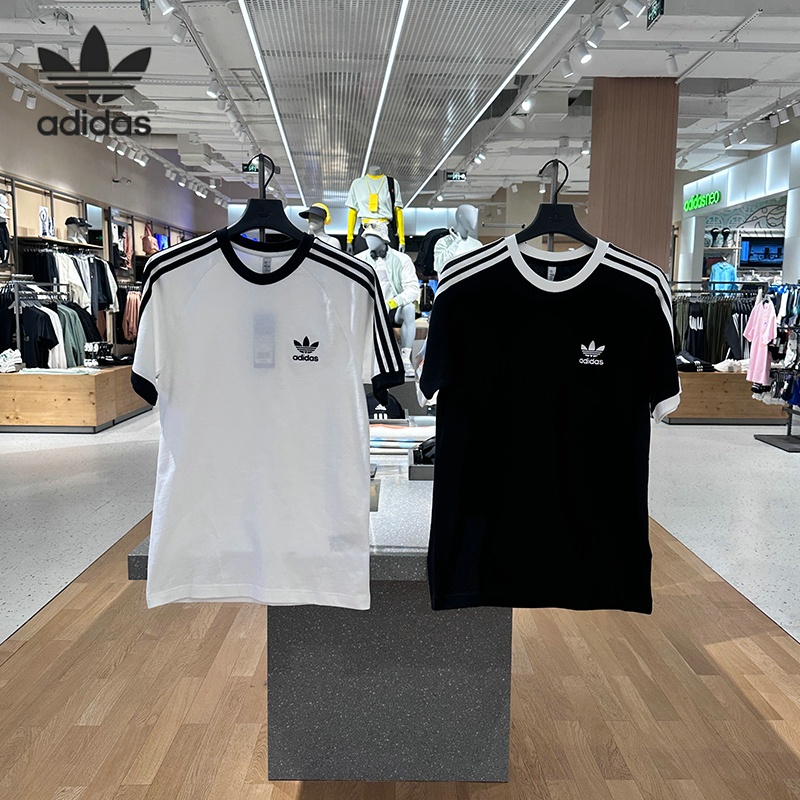 【พร้อมส่ง】ของแท้ 100% เสื้อยืดลําลอง แขนสั้น คอกลม พิมพ์ลาย Adida s Clover สีดํา และสีขาว สําหรับผู้