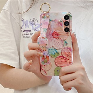 เคสโทรศัพท์มือถือ TPU นิ่ม ปิดด้านหลัง ลายดอกไม้ สีม่วง สีชมพู พร้อมสายรัดข้อมือ สําหรับ Samsung Galaxy A14 A34 A54 A04e LTE 5G 4G GalaxyA54 GalaxyA34